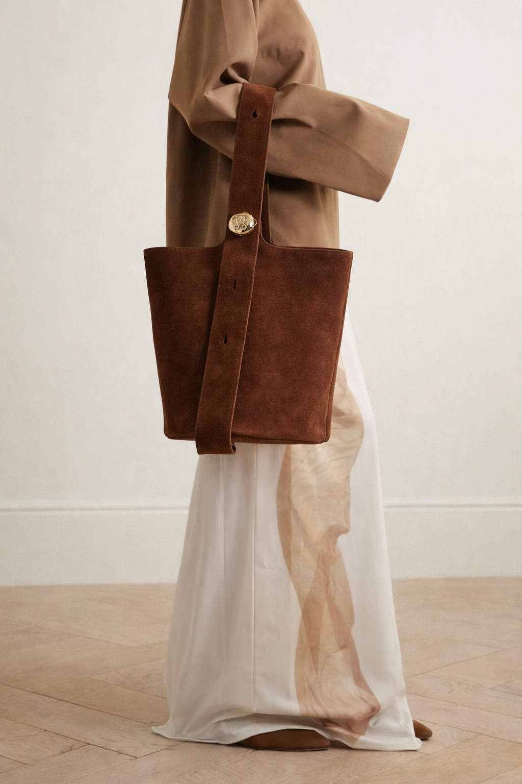 Pebble embellished suede bucket bag